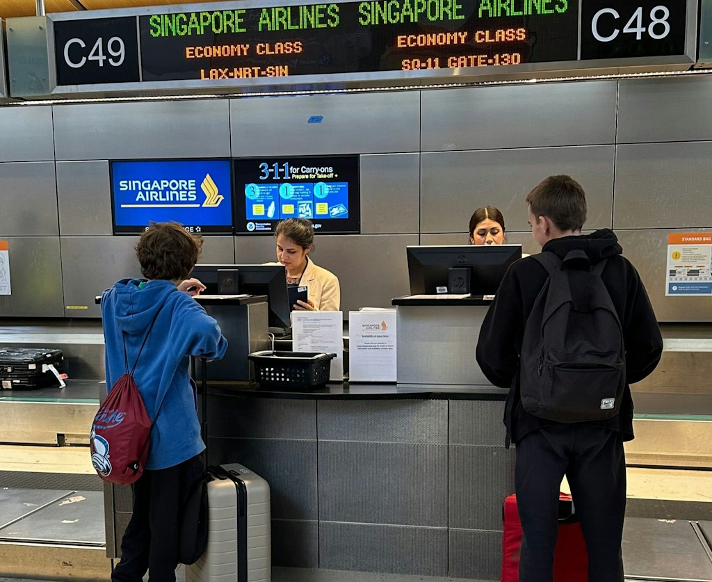 Teen Travel Documents Guide students checking in for their trip at the airport