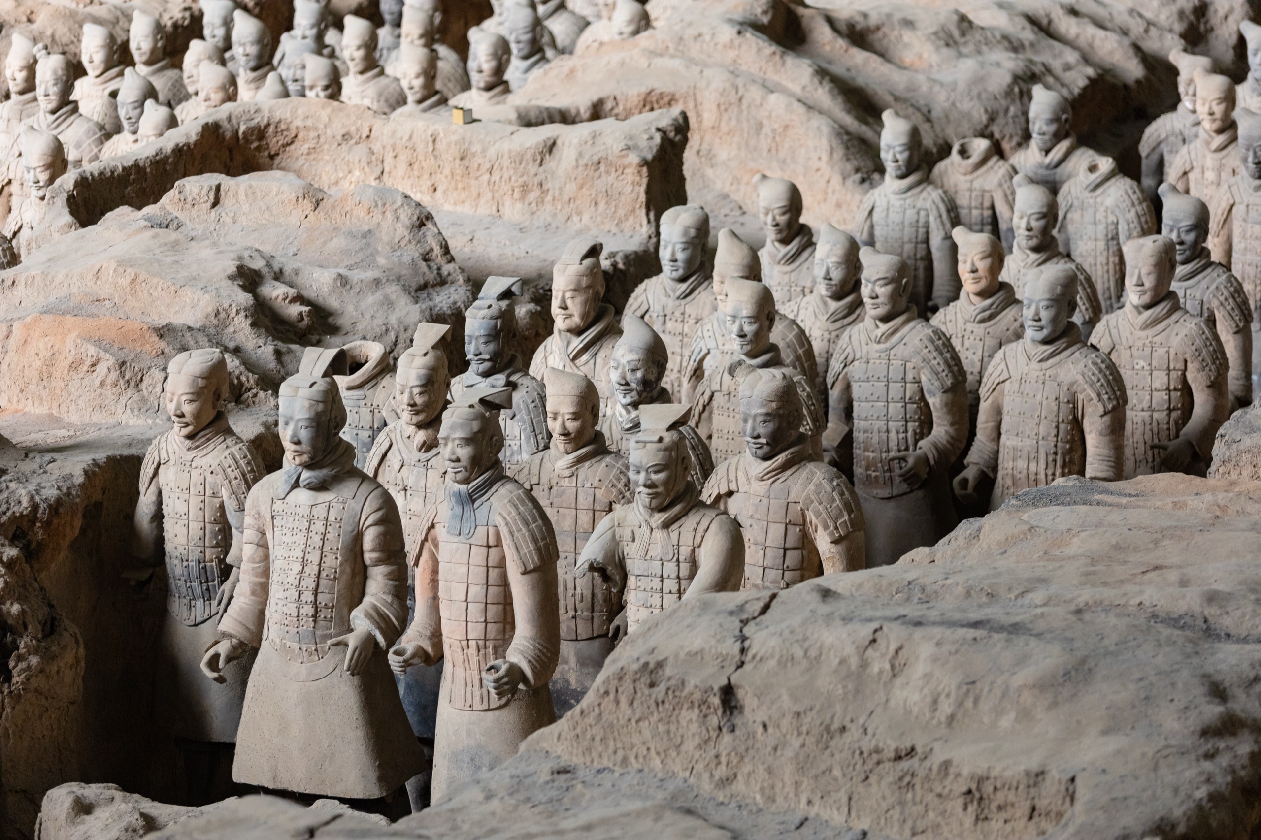 Ranks of life-sized Terracotta Army warriors standing in the excavation pit at Xi'an, China