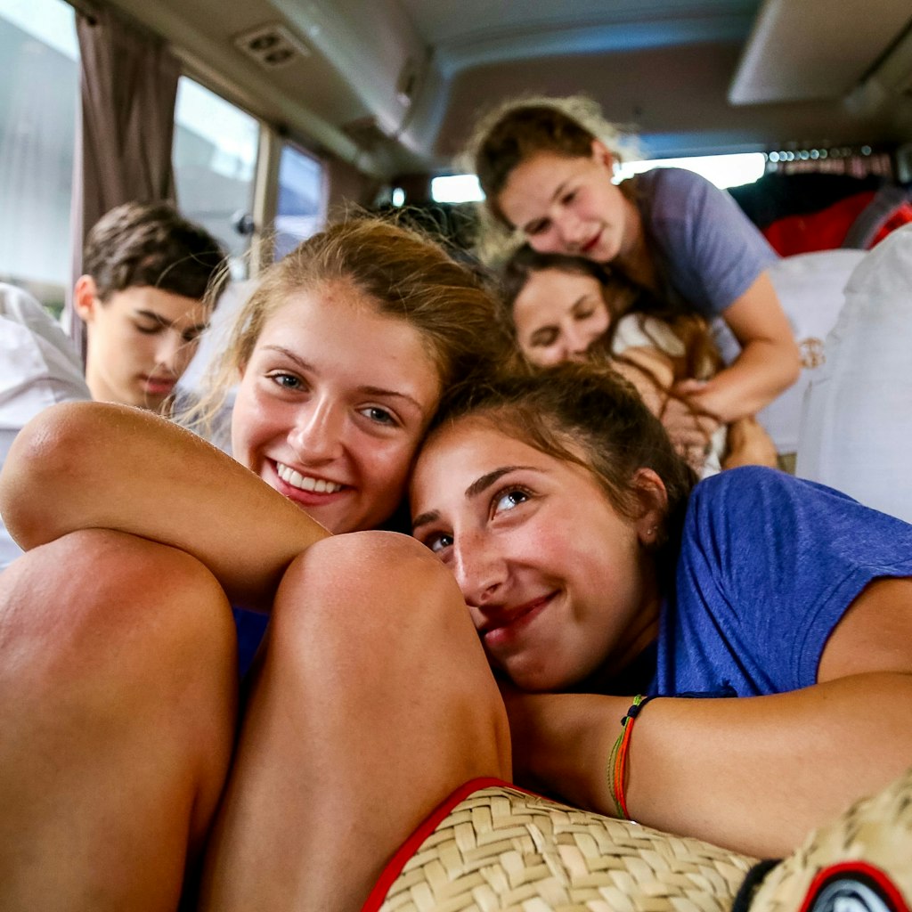 on a travel with teens we see five teenagers in a car