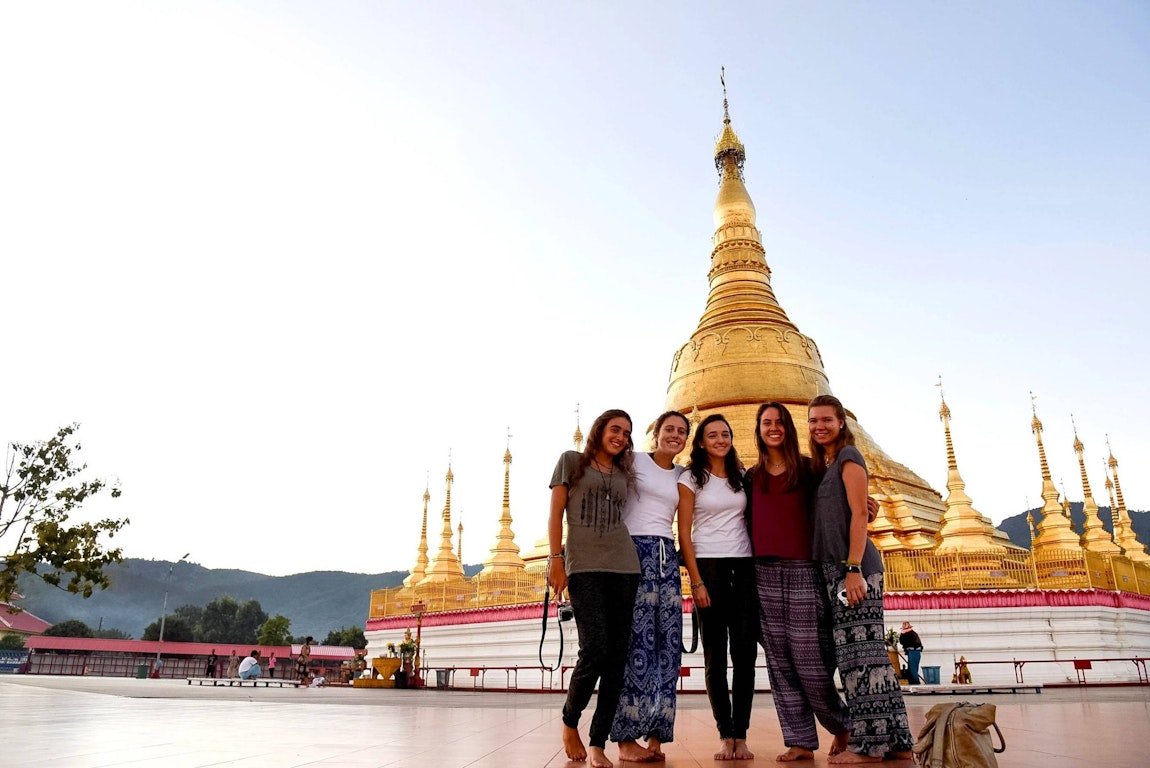 Cultural immersion is a popular type of gap year program, shown here with students visiting a golden temple in Southeast Asia
