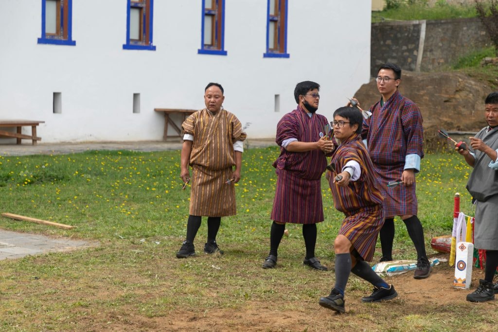 Bhutan men wearing Gho, traditional men clothing of Bhutan