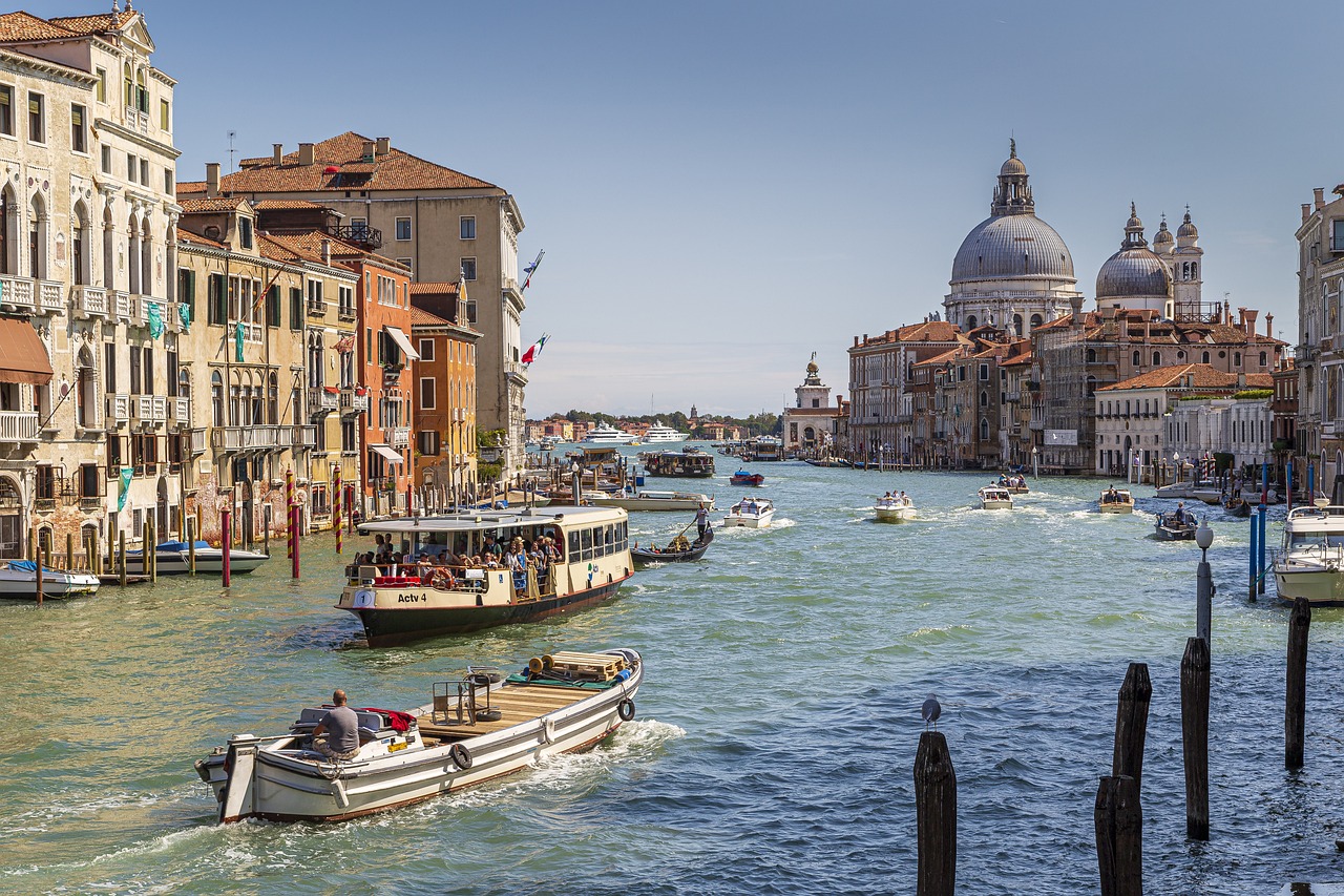 Students cruise Venice's Grand Canal by boat with the Santa Maria della Salute dome in the background